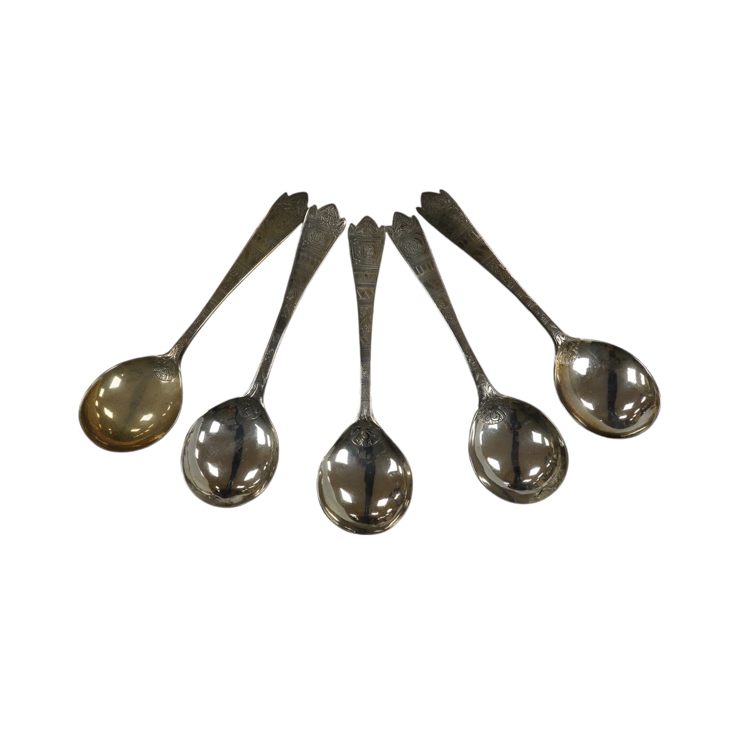 Five assorted George III and later serving spoons with later engraved decoration, earliest London, 1791, 16.8cm, 6.4oz. Condition - fair